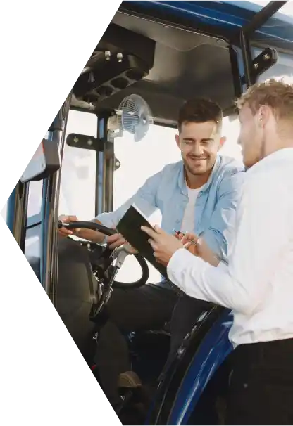 man working farm equipment