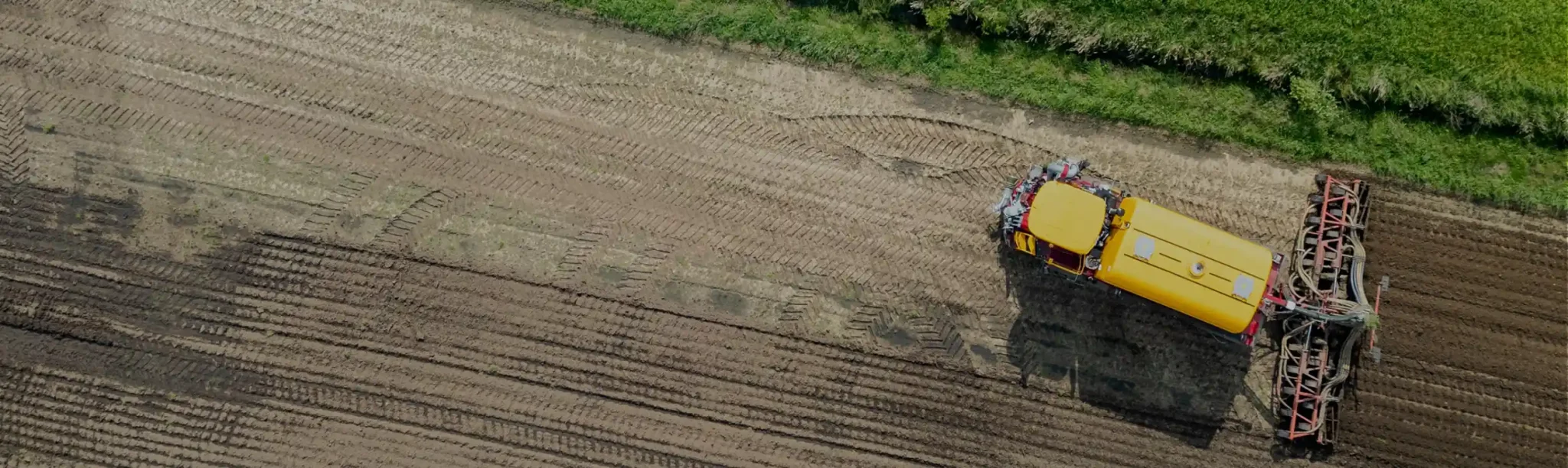 A tractor tilling a field